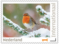 Postzegels 5 x Internationaal roodborstje